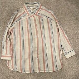 Women’s size small button up shirt with collar and side splits.  New with tags.